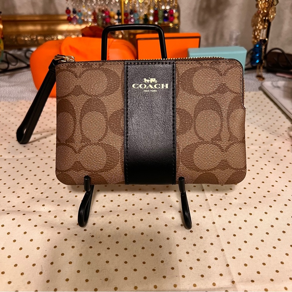 NWOT Coach wristlet. Coated canvas. Leather trim.